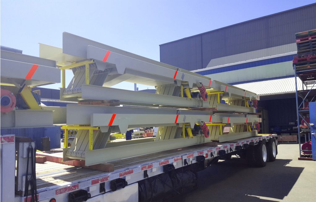 full vibrating conveyor system loaded to ship to an Optimil Machinery Inc. customer in the sawmill industry